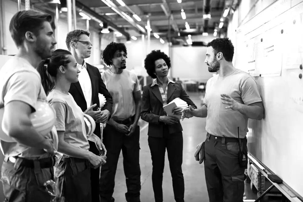A team talking on the factory floor