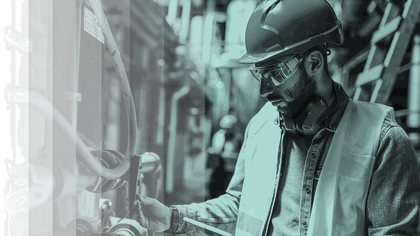 Manufacturing team collaborating with integrated technology solutions
